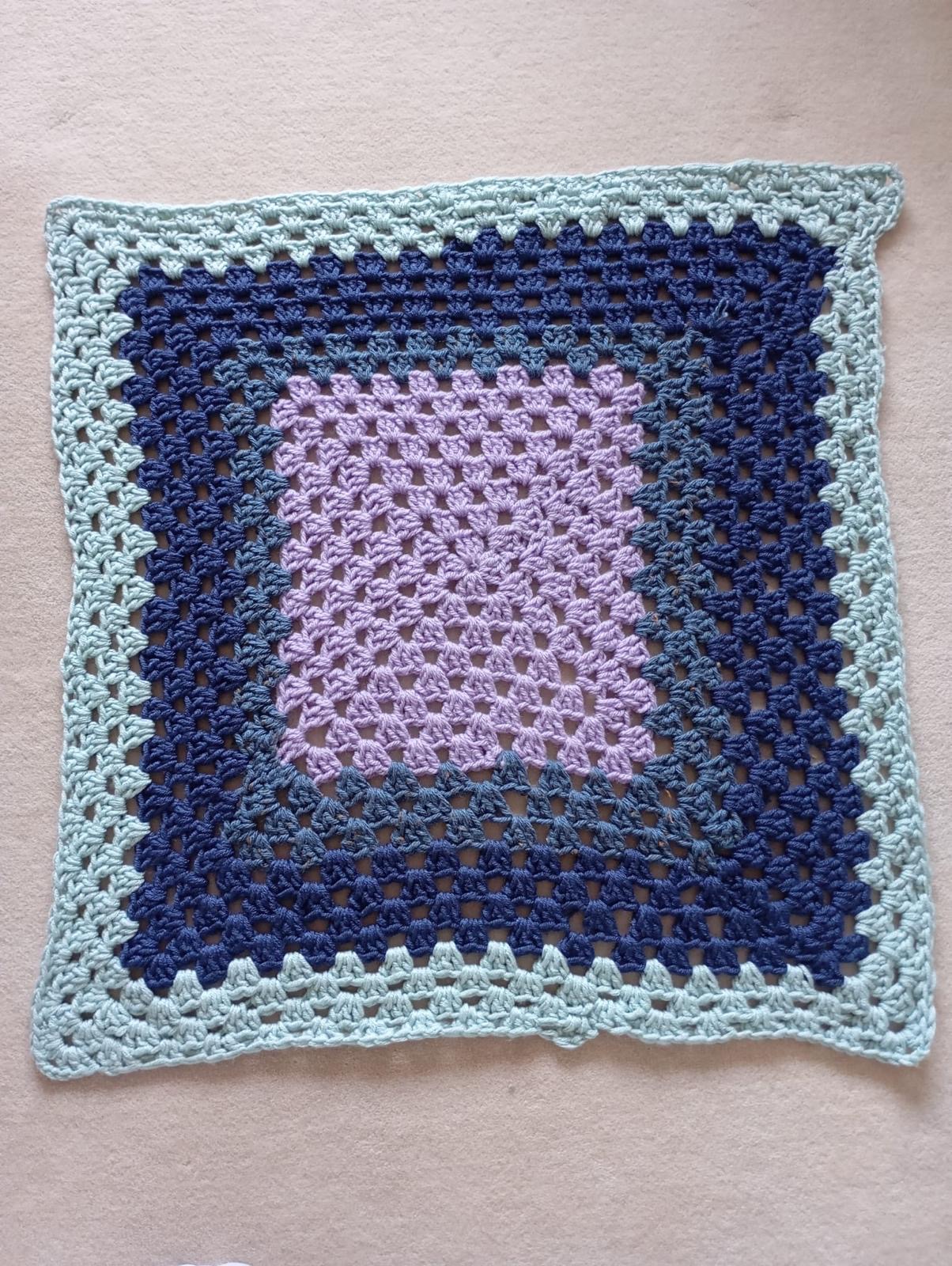 Crochet granny square blanket in lilac, navy and mint with soft open squares